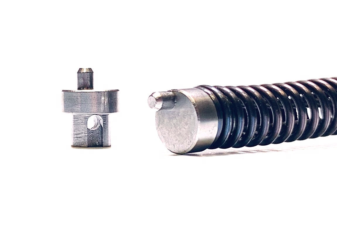 KEL-TEC SUB-2000 Integrated Tool-Less Locking Pin Next to SUB 2000 Recoil Spring Assembly