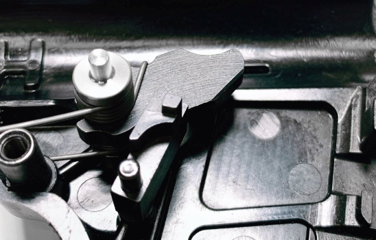 Close-up of KEL-TEC SUB-2000 Stainless Steel Hammer Bushing Installed in Disassembled SUB 2000